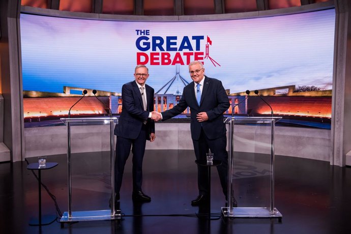 Australian Prime Minister Scott Morrison (right) and Opposition Leader Anthony Albanese shake hands during the second leaders' debate ahead of the federal election at Nine Studios in Sydney, Sunday, May 8, 2022. (AAP Image/Pool, James Brickwood) NO ARCH