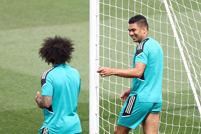 Carlos Henrique Casemiro talks to Marcelo Vieira Da Silva during the training session of Real Madrid before the Final match of UEFA Champions League against Liverpool FC at Ciudad Deportiva del Real Madrid on May 24, 2022, in Valdebebas, Madrid Spain.