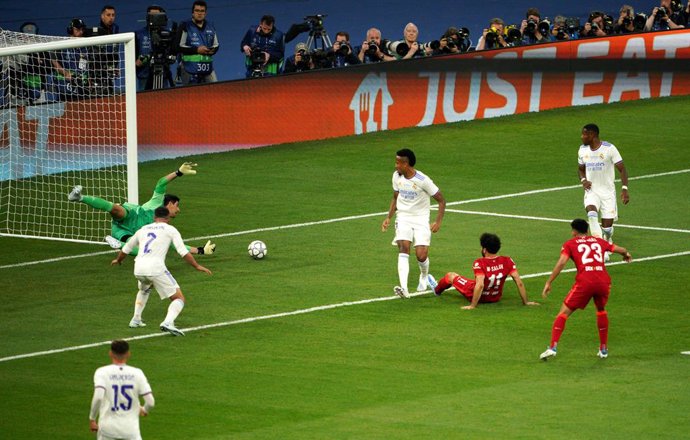 28 May 2022, France, Paris: Real Madrid Goalkeeper Thibaut Courtois saves from Liverpool's Mohamed Salah during the UEFA Champions League final soccer match between Liverpool FC and Real Madrid CF at the Stade de France. Photo: Peter Byrne/PA Wire/dpa