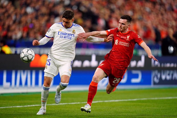 28 May 2022, France, Paris: Real Madrid's Federico Valverde (L) and Liverpool's Andrew Robertson battle for the ball during the UEFA Champions League final soccer match between Liverpool FC and Real Madrid CF at the Stade de France. Photo: Adam Davy/PA 
