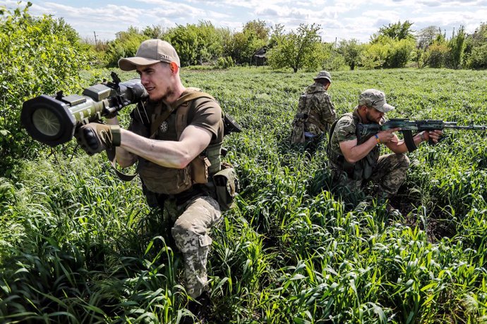 May 17, 2022, Donetsk, Donbas, Ukraine: Ukrainian soldiers from an intelligence hold up weapons as they conduct a patrol and monitoring operation on the outskirt of the separatist region of Donetsk (Donbas), amid Russian invasion of Ukraine. The unit ha