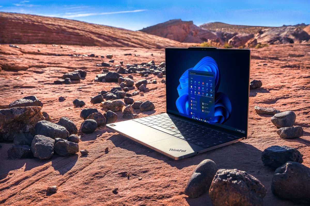  A ThinkPad laptop sits on the rocky ground of a desert, representing Lenovo's commitment to sustainability.