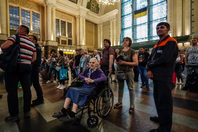 June 14, 2022, Kyiv, Kyiv, Ukraine: An elderly Ukrainian woman with a disability and other passengers wait for trains in Kyiv, as people have been returning to their war-ravaged hometowns across Ukraine, following the Russian invasion of the country.