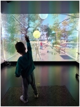 Niño explotando pompas