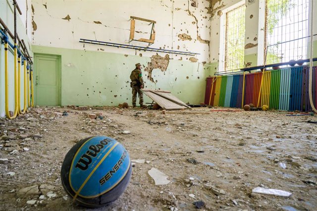 File – Ukrainian soldier in a bombed school in the town of Luch near the border with Kherson province, occupied by Russian forces