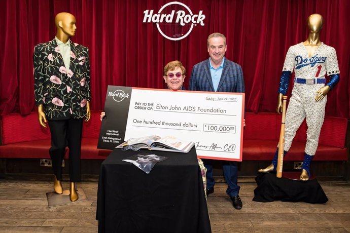 Hard Rock International presents Elton John with check for Elton John AIDS Foundation at London Hard Rock Cafe. Photo Credit: BEN GIBSON PHOTO