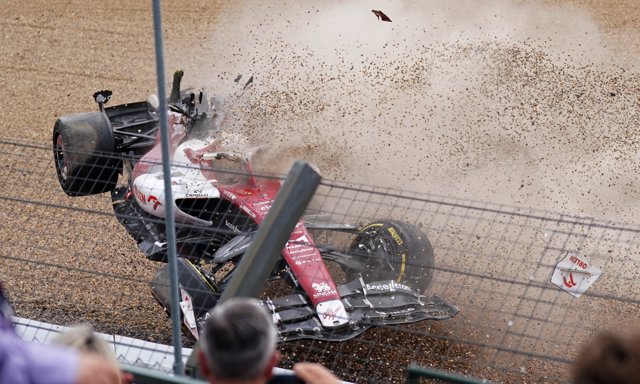 03 July 2022, United Kingdom, Towcester: Chinese F1 driver Zhou Guanyu of Alfa Romeo crashes into the barrier after a collision during the start of the race of the British Grand Prix 2022 at Silverstone Circuit. Photo: Tim Goode/PA Wire/dpa