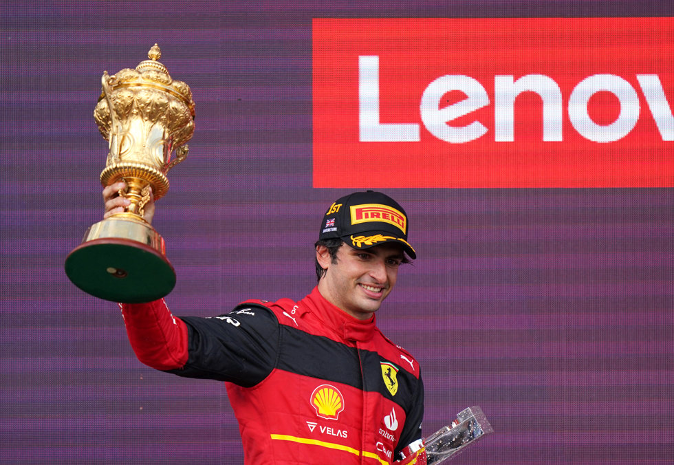 03 July 2022, United Kingdom, Towcester: Spanish F1 driver Carlos Sainz Jr. of team Ferrari the trophy after winning the British Grand Prix 2022 at Silverstone Circuit. Photo: Tim Goode/PA Wire/dpa