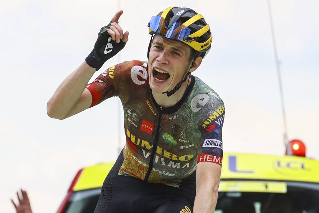 Danish cyclist Jonas Vingegaard of Jumbo-Visma crosses the finish line to win the 11th stage of the 109th edition of the Tour de France cycling race, a 152-kilometer-long mountain stage from Albertville to Col du Granon.
