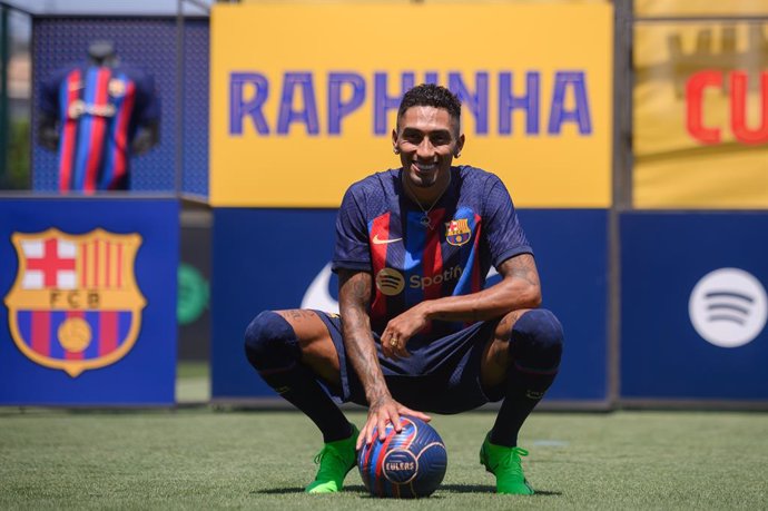 15 July 2022, Spain, Barcelona: New signing Raphinha poses for pictures during his unveiling by FC Barcelona at Ciutat Esportiva Joan Gamper. Photo: Gerard Franco/DAX via ZUMA Press Wire/dpa