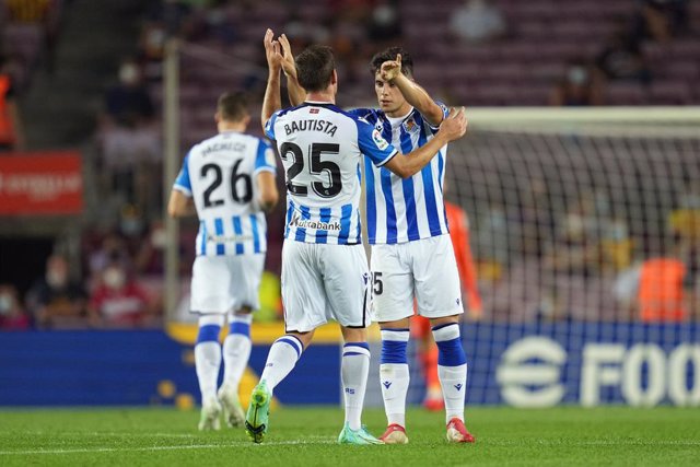Archivo - 15 August 2021, Spain, Barcelona: Real Sociedad's Julen Lobete (R) celebrates scoring his side's first goal with teammate  Jon Bautista during the Spanish LaLiga soccer match between FC Barcelona and Real Sociedad at Camp Nou Stadium. Photo: -/L
