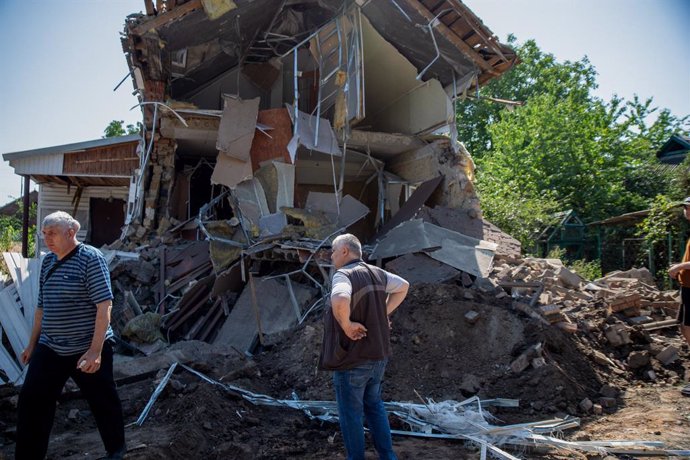 August 29, 2022, Kostyantynivka, Ukraine: Two men clear rubble after an overnight shelling hits at a local Baptist church. Since the invasion, Donbas has been subject to heavy destruction from aerial bombardment, shelling and artillery.,Image: 717416007
