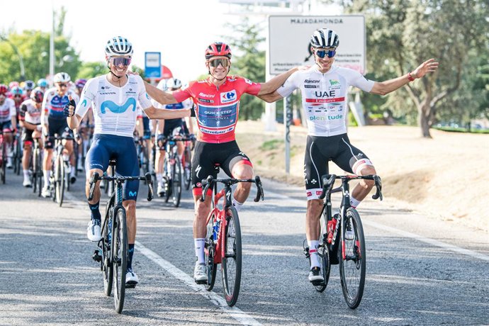 Remco Evenepoel (Quickstep-AlphaVinyl), Enric Mas (Movistar Team) and Juan Ayuso (UAE) celebrate during the 77th Tour of Spain 2022, Stage 21 a 96,7km stage from Las Rozas to Madrid / #LaVuelta22 / #WorldTour / on September 11, 2022 in Madrid, Spain