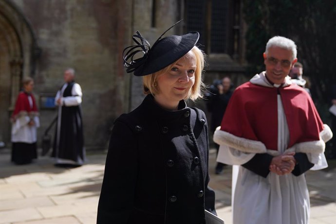 16 September 2022, United Kingdom, Cardiff: UKPrime Minister Liz Truss (L)leaves after attending a prayer and memorial service for the life of Queen Elizabeth II at Llandaff Cathedral in Cardiff. Photo: Jacob King/PA Wire/dpa