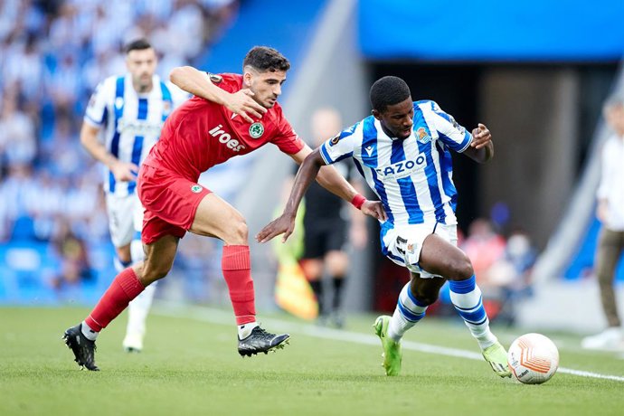 Mohamed - Ali Cho of Real Sociedad competes for the ball with Paris Psaltis of AC Omonoia during the Europa League football match between Real Sociedad and AC Omonia at Reale Arena on September 15, 2022, in San Sebastian, Spain.