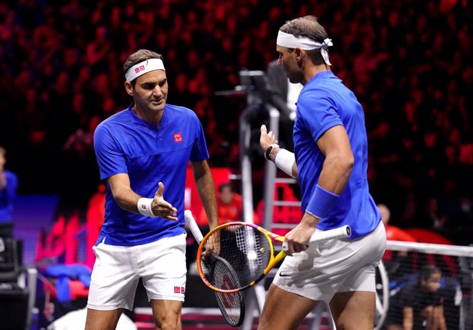 23 September 2022, United Kingdom, London: Team Europe's Rafael Nadal from Spain (R) and Roger Federer from Switzerland in action against Team World's Frances Tiafoe and Jack Sock from USA on day one of the Laver Cup at the O2 Arena. Photo: John Walton/