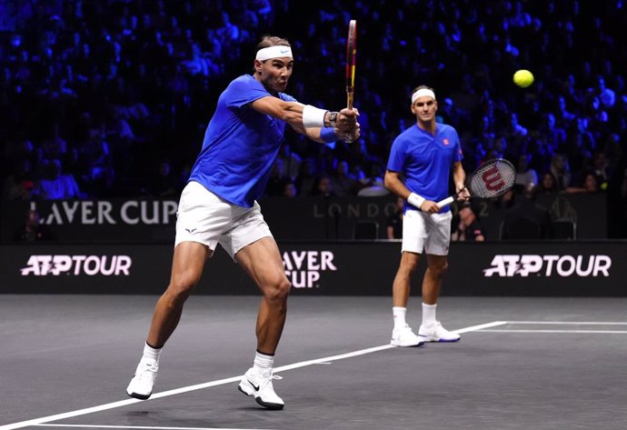 23 September 2022, United Kingdom, London: Team Europe's Rafael Nadal from Spain (L) and Roger Federer from Switzerland in action against Team World's Frances Tiafoe and Jack Sock from USA on day one of the Laver Cup at the O2 Arena. Photo: John Walton/