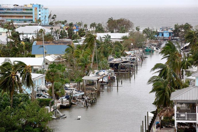 29 September 2022, US, Fort Myers: Homes, boats and docks are seen damaged by Category 4 Hurricane Ian in Florida. Photo: Douglas R. Clifford/Tampa Bay Times via ZUMA Press/dpa