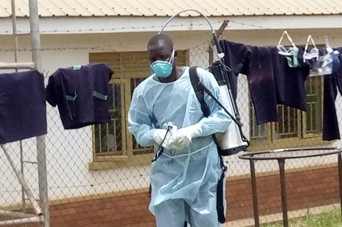 MUBENDE, Sept. 25, 2022  -- A medical worker is seen after disinfecting a demarcated Ebola treatment center at the Mubende Regional Hospital in Mubende District, Uganda, Sept. 21, 2022. Uganda's Ministry of Health said it has registered four more cases 