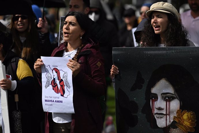 Protesters gather outside Parliament House to protest the death of Mahsa Amini in Iran at Parliament House in Canberra, Tuesday, September 27, 2022. On 16 September 2022, a 22-year-old Iranian woman named Mahsa Amini died in Tehran, Iran, under suspicio