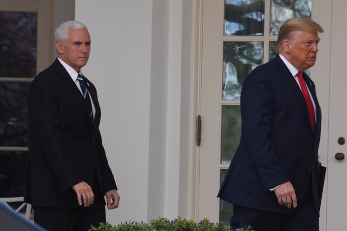 Archivo - 13 March 2020, US, Washington: US President Donald Trump (R) and US Vice President Mike Pence arrive to attend a press conference in The Rose Garden, where Trump to announce a national emergency to combat the novel coronavirus outbreak. Photo: