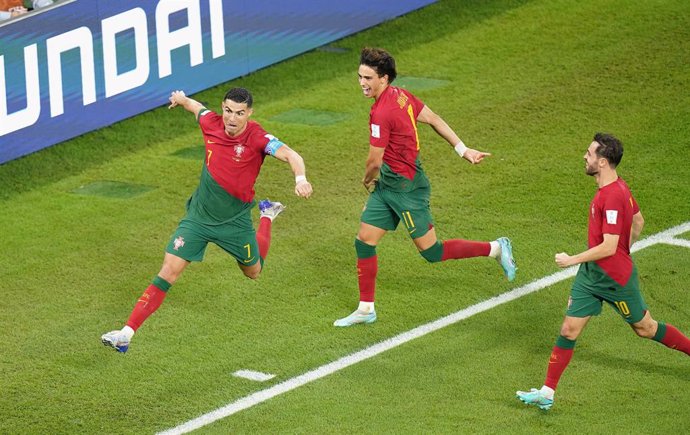 24 November 2022, Qatar, Doha: Portugal's Cristiano Ronaldo (L) celebrates scoring his side's first goal from the penalty spot during the FIFA World Cup Qatar 2022 Group H soccer match between Portugal and Ghana at Stadium 974. Photo: Adam Davy/PA Wire/