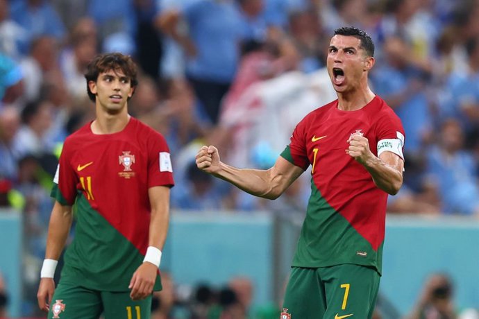 28 November 2022, Qatar, Lusail: Portugal's Cristiano Ronaldo (R) ceelbrates his side's first goal during the FIFA World Cup Qatar 2022 Group H soccer match between Portugal and Uruguay at Lusail Stadium. Photo: Tom Weller/dpa
