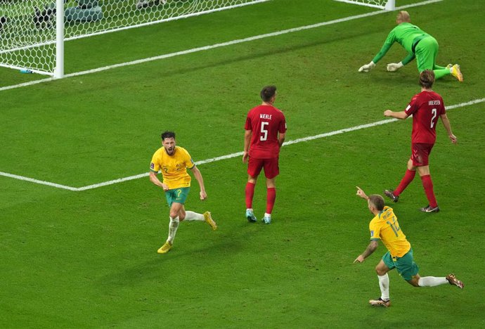 30 November 2022, Qatar, Al Wakrah: Australia's Mathew Leckie celebrates scoring his side's first goal during the FIFA World Cup Qatar 2022 Group D soccer match between Australia and Denmark at the Al Janoub Stadium. Photo: Martin Rickett/PA Wire/dpa