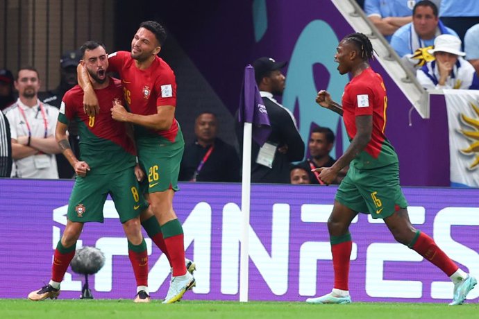 28 November 2022, Qatar, Lusail: Portugal's Bruno Fernandes (L) celebrates scoring his side's second goal with teammates Goncalo Ramos (C) and Rafael Leao during the FIFA World Cup Qatar 2022 Group H soccer match between Portugal and Uruguay at Lusail S
