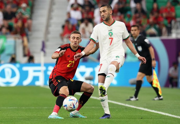 27 November 2022, Qatar, Doha: Belgium's Timothy Castagne and Morocco's Hakim Ziyech battle for the ball during the FIFA World Cup Qatar 2022 Group F soccer match between Belgium and Morocco at Al Thumama Stadium. Photo: Bruno Fahy/BELGA/dpa