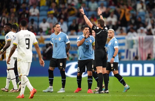 Uruguay's Luis Suarez appeals to referee Daniel Siebert after the latter signaled a penalty kick for Ghana during the FIFA World Cup Qatar 2022 Group H soccer match between Ghana and Uruguay at Al Janoub Stadium