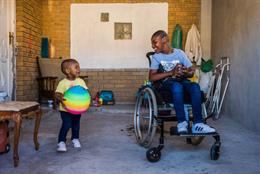 Two Children Play After A Wheelchair Fitting At Shonaquip Social Enterprises In Cape Town, South Africa. The Clinton Health Access Initiative (CHAI) Is Working To Ensure That The Right Assistive Technology, Including Wheelchairs, Hearing Aids And Glass