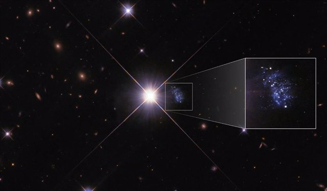 La pequeña galaxia HIPASS J1131–31 se asoma detrás del resplandor de la estrella TYC 7215-199-1, una estrella de la Vía Láctea situada entre el Hubble y la galaxia.