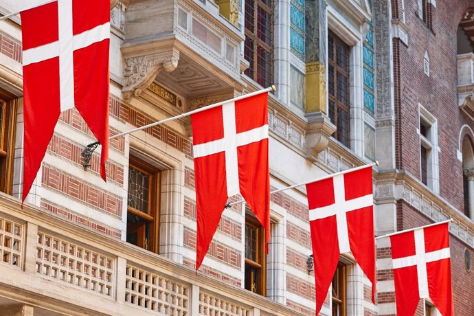 Danish flags on Copenhagen City Hall (Credit: Adobe Stock)