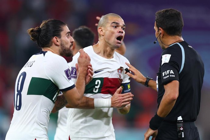 10 December 2022, Qatar, Doha: Portugal's Ruben Neves and Pepe call for a penalty kick from Argentine referee Facundo Tello during the FIFA World Cup Qatar 2022 Quarter-Final soccer match between Morocco and Portugal at Al-Thumama stadium. Photo: Tom We