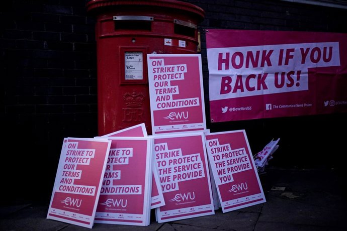 24 November 2022, United Kingdom, London: Placards piled up for postal workers from the Communication Workers Union (CWU) on the picket line at the Camden Town Delivery Office during a 48-hour strike in a long-running dispute over jobs, pay and conditio