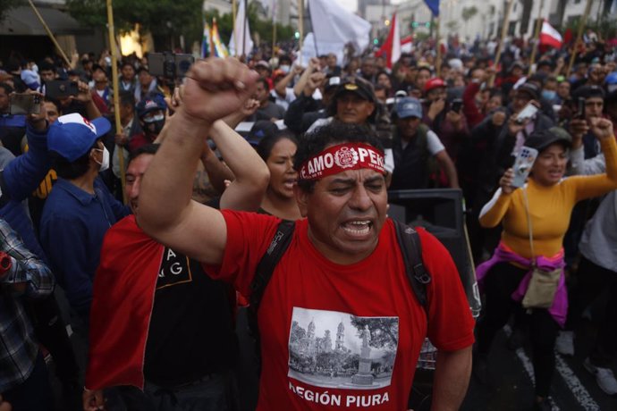 09 December 2022, Peru, Lima: Protesters shout slogans during the third day of demonstrations for the release of former Peru's President Pedro Castillo. Peru's Congress voted Wednesday to remove Castillo from office and replace him with Vice President s