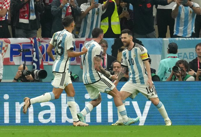 13 December 2022, Qatar, Lusail: Argentina's Lionel Messi (R) celebrates scoring his side's first goal with teammates during the FIFA World Cup Qatar 2022 semi final soccer match between Argentina and Croatia at the Lusail Stadium. Photo: Nick Potts/PA 