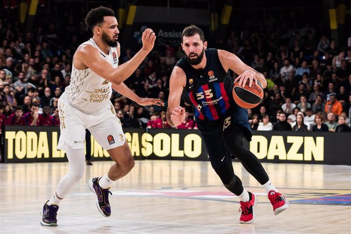 Nikola Mirotic of FC Barcelona in action against Amine Noua of LDLC Asvel  during the Turkish Airlines EuroLeague match between FC Barcelona and LDLC Asvel  at Palau Blaugrana on December 09, 2022 in Barcelona, Spain.