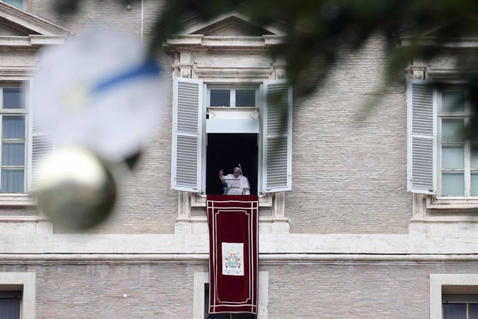 04 December 2022, Vatican, Vatican City: Pope Francis delivers the Angelus prayer from  the window overlooking St. Peter's Square, where the manger and Christmas tree are set up. Photo: Evandro Inetti/ZUMA Press Wire/dpa