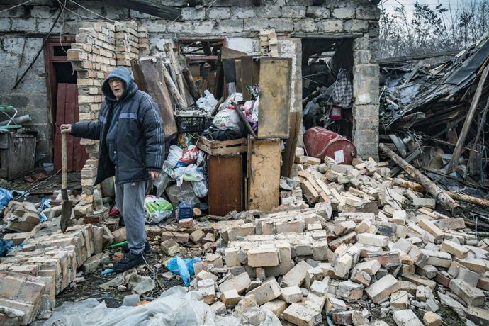 December 10, 2022, Kostiantynivka, Donetsk, Ukraine: A man tries to recover his belongings of his total destroyed home in a rocket impact after a russian shelling over Kostiantynivka, a village in Donbass region. Explosion made a huge devastation in the