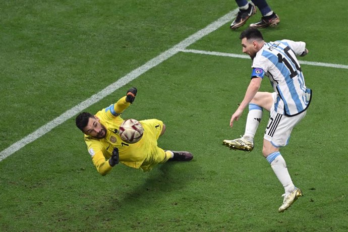 18 December 2022, Qatar, Lusail: Argentina's Lionel Messi scores his side's third goal past France goalkeeper Hugo Lloris during the FIFA World Cup Qatar 2022 final soccer match between Argentina and France at the Lusail Stadium. Photo: Robert Michael/d