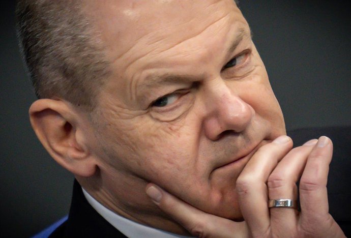 14 December 2022, Berlin: German Chancellor Olaf Scholz follows the debate in a Bundestag session after his government statement on the EU Council and the EU/Asean Summit. Photo: Michael Kappeler/dpa
