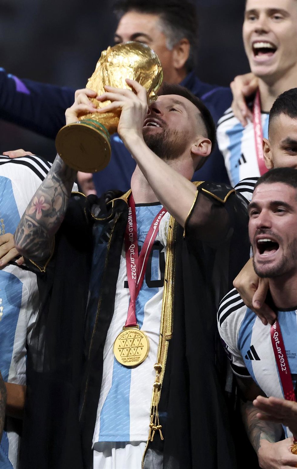 Lionel Messi of Argentina holding the World Cup and teammates celebrate during the trophy ceremony following the FIFA World Cup 2022, Final football match between Argentina and France on December 18, 2022 at Lusail Stadium in Al Daayen, Qatar - Photo Je