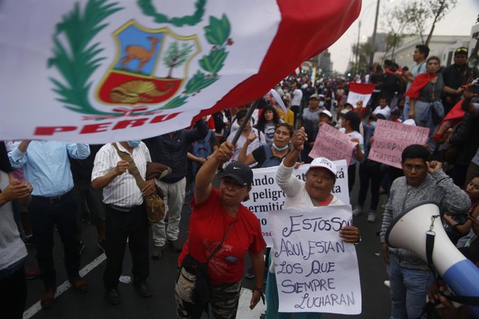 09 December 2022, Peru, Lima: Protesters shout slogans during the third day of demonstrations for the release of former Peru's President Pedro Castillo. Peru's Congress voted Wednesday to remove Castillo from office and replace him with Vice President s