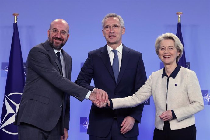 HANDOUT - 10 January 2023, Belgium, Brussels: (L-R)European Council President Charles Michel, NATO Secretary General Jens Stoltenberg and European Commission President Ursula von der Leyen shake hands after signing the Joint Declaration on EU-NATO Coop