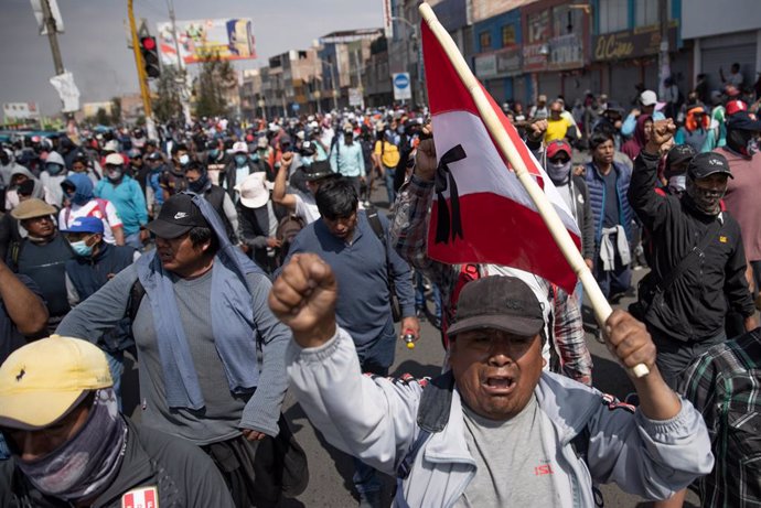 14 December 2022, Peru, Arequipa: Supporters of deposed Peruvian President Castillo take part in a protest. The Peruvian government has declared a state of emergency across the country in the face of increasingly violent protests against the ouster of P