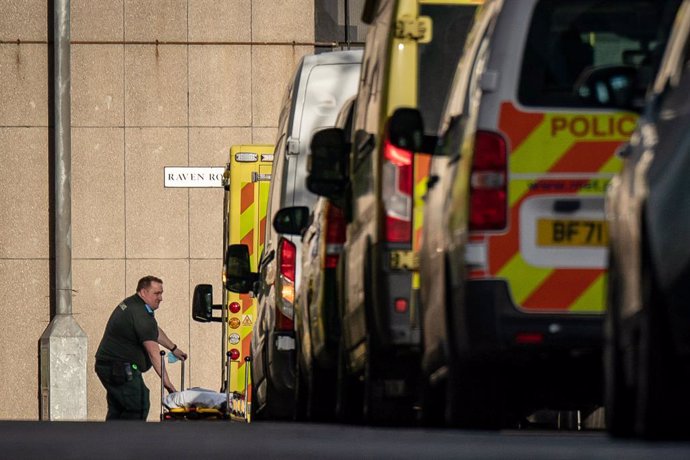 06 January 2023, United Kingdom, London: Ambulances wait at an Emergency Department (A&E) at the Royal London hospital in London, as flu cases in hospitals in England are continuing to rise while ambulance handover delays have hit a new high, as the Nat