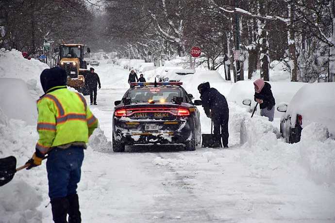 26 December 2022, US, Buffalo: Troopers assist road-clearing crews and check for stranded motorists. Buffalo city announced a driving ban during the blizzard. Photo: -/New York State Police via ZUMA Press Wire Service/dpa