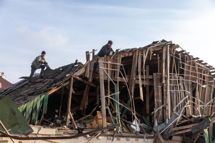 January 3, 2023, Kyiv, Ukraine: Volunteers clear and dismantle debris at the site of a Russian missile attack on December 31. On Saturday, December 31, the Russian Armed Forces massively attacked Ukrainian cities with cruise missiles. As a result of the